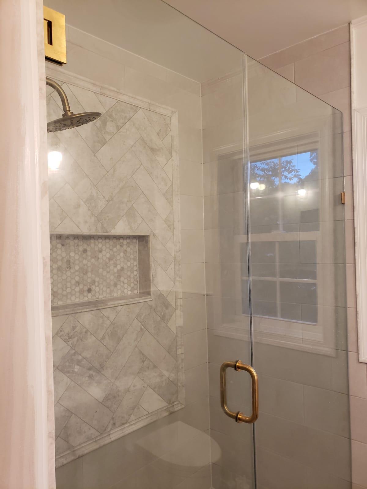 Herringbone tile shower with mosaic niche, custom bathroom remodel Northern Virginia