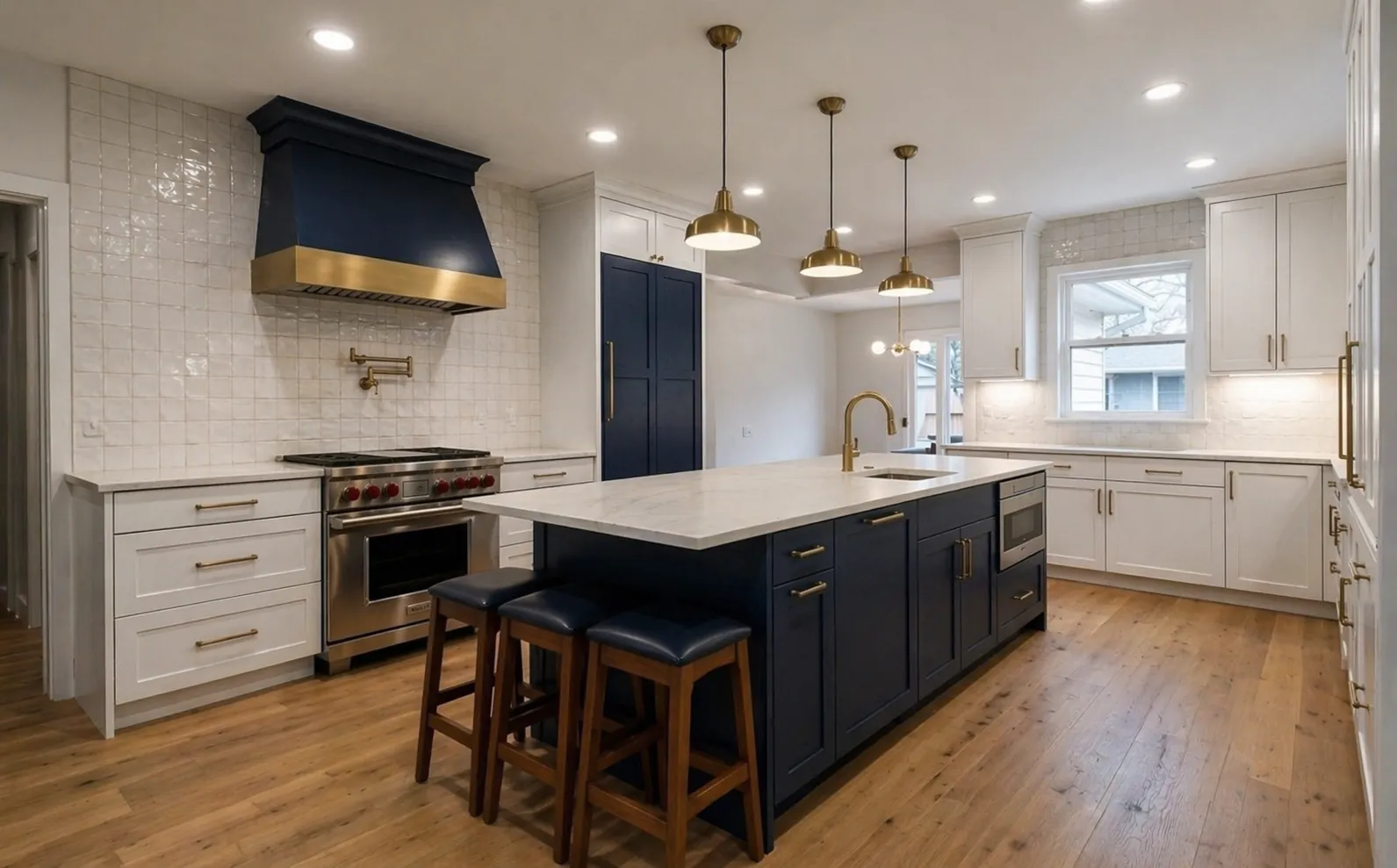 Richmond VA kitchen remodel with navy island, brass pendants, and white oak floors by Masters Touch Construction